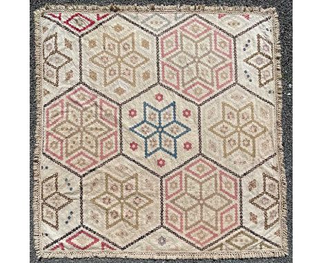 A Victorian patchwork quilt with hexagonal panels the centre panel embroidered with 1890 F B 1893 the edge with plated border