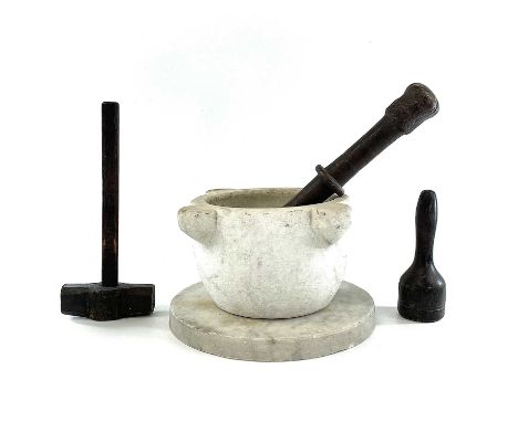 A marble mortar height of 13.5cm with hardwood turned pestle together with a circular marble slab and two wood tools.