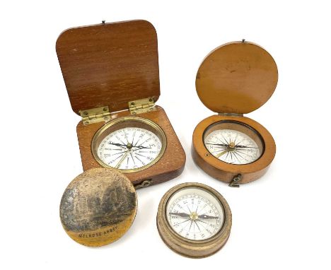 A 19th century compass with a printed card dial in a boxwood case of circular form 6cm diameter, together with a mahogany squ