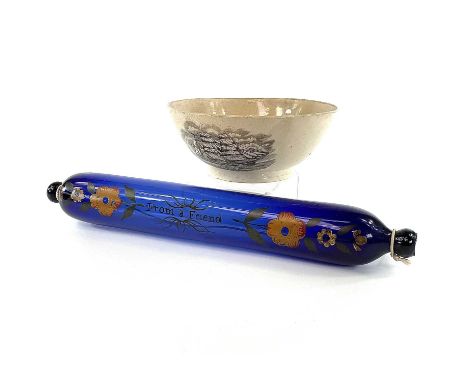 A 19th century Bristol blue glass rolling pin with transfer printed floral decoration and inscribed 'To A Friend' length 38cm