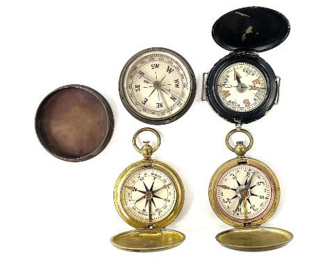 An early 20th century brass compass with cover, together with three other compasses. (4)