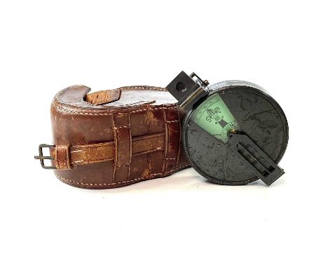 A 19th century prismatic compass by J. Hicks Hatton Gardens London in leather case, diameter 7cm.