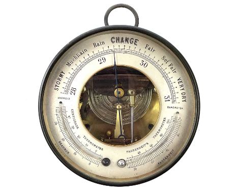 A Holosteric brass Barometer, with Fahrenheit and Reaumur thermometers, in a brass case, diameter 17cm.