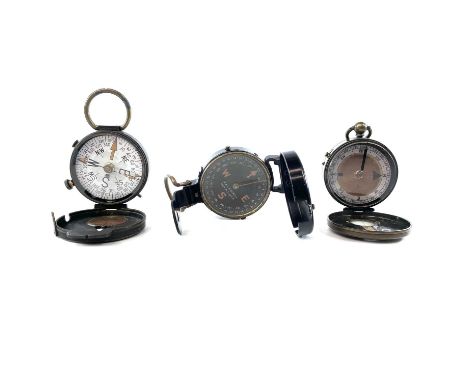 An early 20th century brass marching compass, together with two other early 20th century marching compasses. (3)