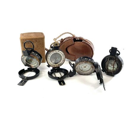 A WWII brass lacquer compass by T.G Co Ltd London stamped NoB 163689 1942 MK III and broad arrow in leather case together wit