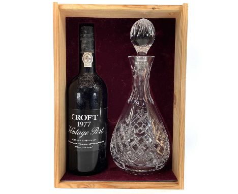 A Croft 1977 vintage port together with a crystal glass decanter and stopper in a presentation box.