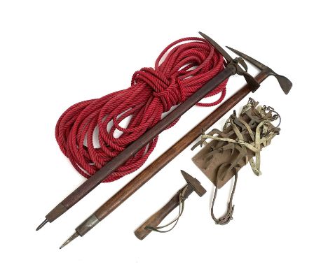 Vintage Mountaineering equipment, comprising two ice axes, a pair of crampons, a rope and a hammer (5).