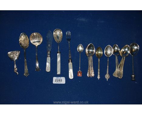 Miscellaneous EPNS spoons and a silver caddy spoon with embossed decoration 
