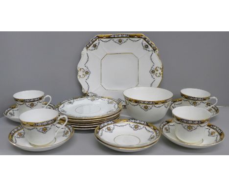 A Beswick &amp; Sons 4494 pattern part tea service comprising cake plate, six side plates and saucers, four cups and a sugar 