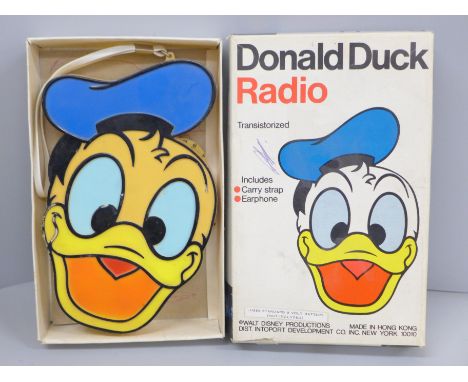 A Donald Duck transistor radio in original box, tested, not working 