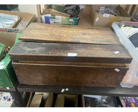 A wooden box of vintage Meccano