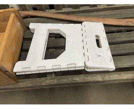 A modern white folding step stool