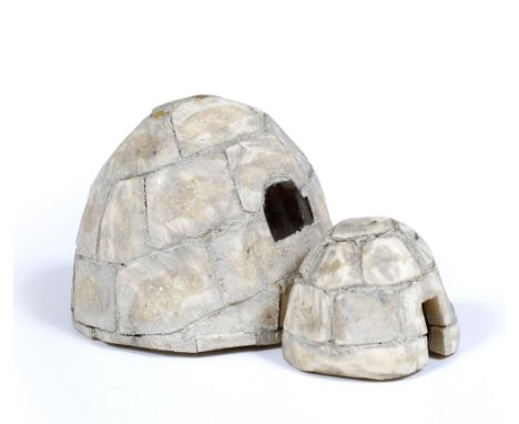 AN ESKIMO BONE MODEL of a double section igloo, 21cm deep x 13cm high; together with a male and female figure, 7cm high (3) -