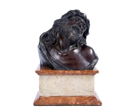 AN ITALIAN BRONZE BUST after the Antique 'Christ of Sorrows' on a rouge marble rectangular plinth, 28cm high