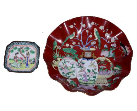 A CHINESE RED GROUND DISH with wavy border decorated vases of flowers with red seal mark, circa 1900, 25.5cm diameter; togeth