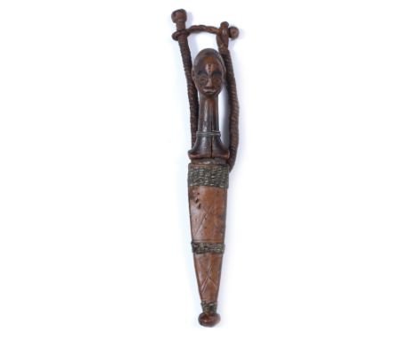 A CENTRAL AFRICAN, CONGO REGION, PENDE TRIBE KNIFE, the carved handle of figural form in an associated leather scabbard with 