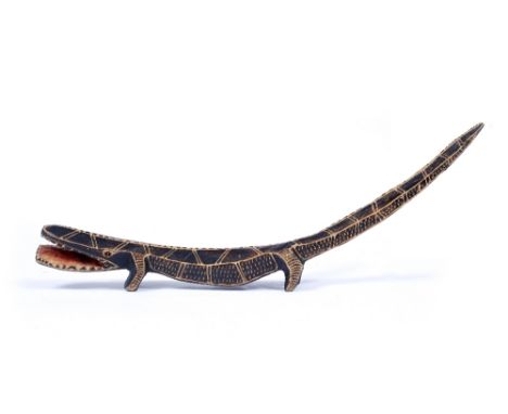 A SOUTH AFRICAN CARVED WOODEN MODEL of a crocodile, 55cm long - Purchased in South Africa in the 1980's