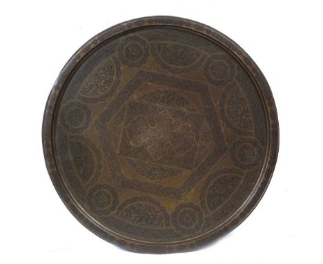 A 19TH CENTURY TURKISH BRONZE LARGE CIRCULAR PLAQUE with finely engraved Islamic script and foliate decoration, 73cm diameter
