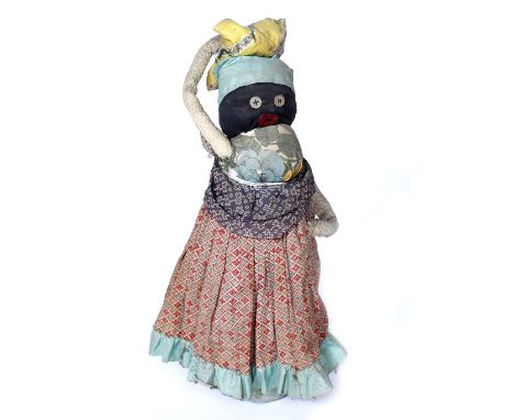 AN AFRICAN, AMERICAN PLANTATION MADE SLAVE DOLL made from colourful scrap textiles and mounted on probably a bottle, 39cm hig