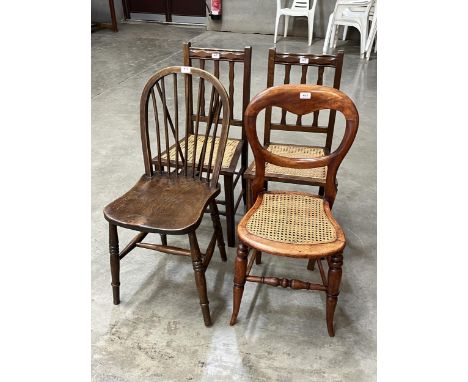 Three cane seat chairs and a stick back kitchen chair.