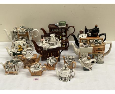 A collection of thirteen Portmeirion novelty teapots.