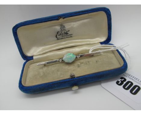 An Art Deco Style Opal (Doublet) Single Stone Bar Brooch, claw set on part textured and inset bar, hook clasp stamped "18k", 