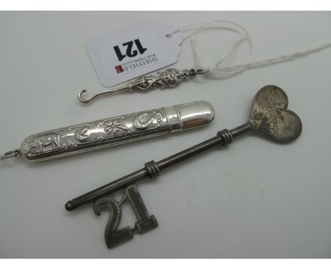 A Needle Case, decorated in relief, stamped "925"; together with an antique style small button hook, handled stamped "925"; a