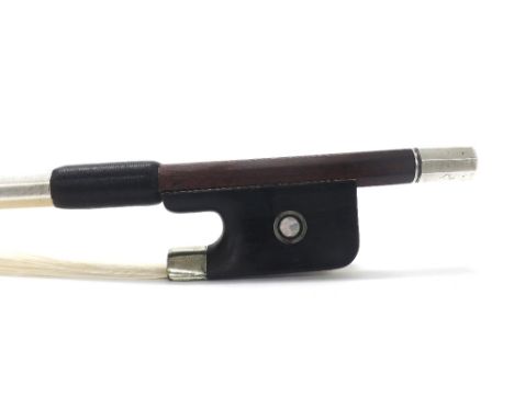 French silver mounted violoncello bow stamped Fetique under the frog, the stick round, the ebony frog inlaid with silver ring