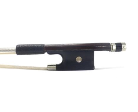 French silver mounted violin bow, unstamped, the stick round, the ebony frog inlaid with pearl eyes and the ebony adjuster wi