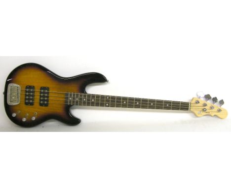 G&L Tribute Series L-2000 bass guitar, sunburst finish with surface wear including some heavy scratches to the back, electric