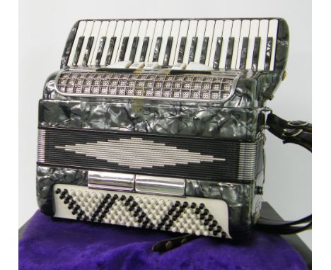 One hundred and twenty button piano accordion labelled Glorick, grey pearl finish, case