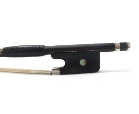 Silver mounted violoncello bow stamped F.N. Voirin á Paris, the stick round, the ebony frog inlaid with pearl eyes and the eb