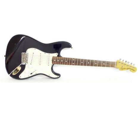 1983 Squier by Fender Stratocaster electric guitar, probably JV series, black finish with heavy wear in places including sign