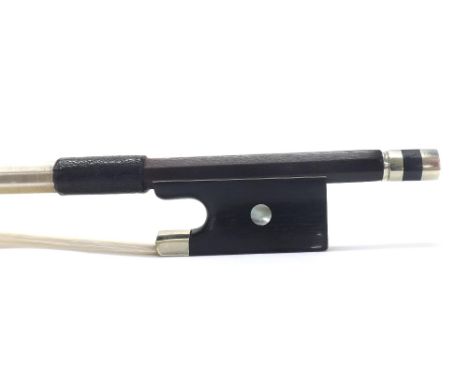 Silver mounted violin bow stamped Caressa & Francaise, the stick round, the ebony frog inlaid with pearl eyes and the ebony a