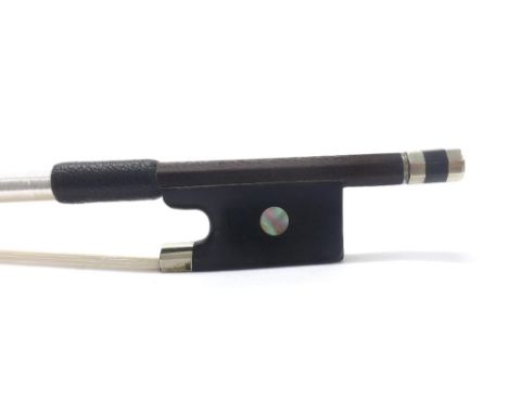 Silver mounted violin bow stamped C. Bazin, the stick round, the ebony frog inlaid with pearl eyes and the ebony adjuster wit