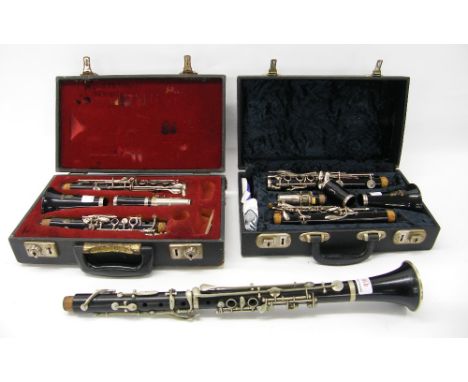 Two Boosey & Hawkes Regent clarinets, both cased; together with another clarinet by and stamped F. Buisson, Paris, Prague, ca
