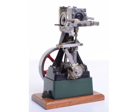A model Stuart 10V vertical steam engine, with top mounted cylinder and valve chest, cast frame with mounted crank shaft and 