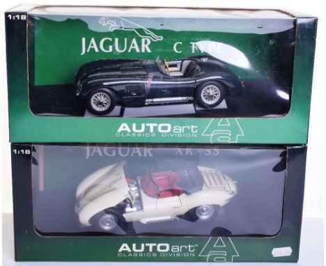 Two Boxed Auto Art 1:18 scale Jaguar Models, XK-SS and C Type, both in very good condition, need a clean where they have been