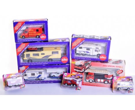 Eight Siku Models, 3129 Motor Home,3130 Dormobile with trailer and Touring Car, 370 Mercedes Fire Engine, 2536 Dormobile Camp