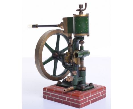 A model single cylinder vertical steam engine, with top mounted cylinder and valve chest, central crank shaft with 3 ¾” (9.5c