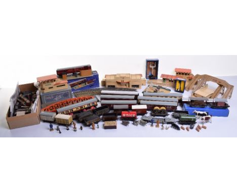 Collection of tinplate Hornby Dublo coaches and wagons, track side buildings and accessories, three suburban coaches maroon l