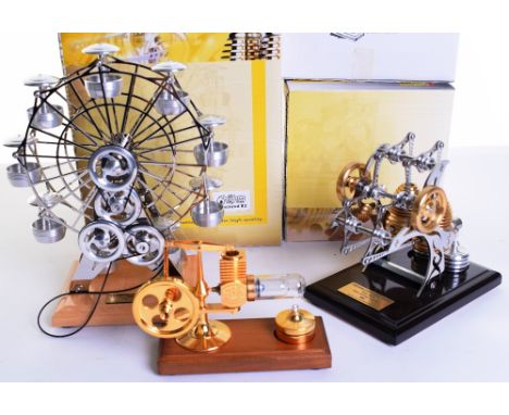 Bóhm Stirling Motor HB32 and type R3 Ferris Wheel, both boxed, mint condition, together with a gold plated Hog Micro Sterling