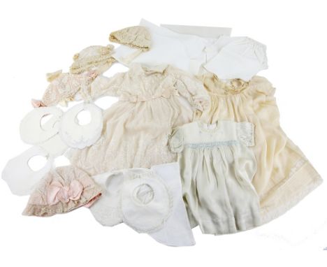 Quantity of  vintage Baby wear to include silk and lace  dress, baby's bonnets, bibs, and pillowcases.    
