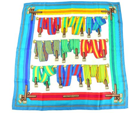 Silk scarf by Hermes in the “Sangles” (Saddle girths) design by Joachim Metz (1985) in bright colours with turquoise border. 