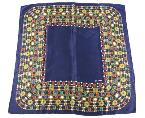 Chanel square silk scarf with typical pearl and jewelled gilt chain motifs on navy blue background. (88 x 88 cm).    Good, li