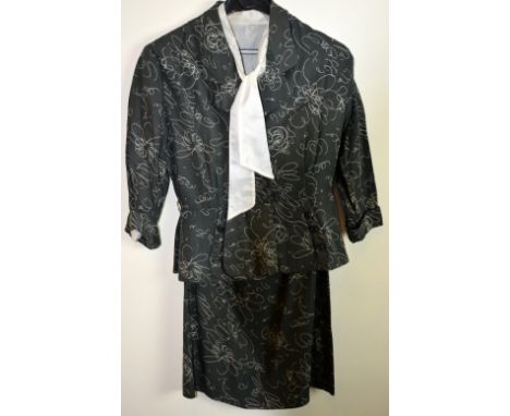 1940's two piece suit with abstact floral print, charcoal grey needle cord, peplum back, labelled 38 , and a cream silk blous