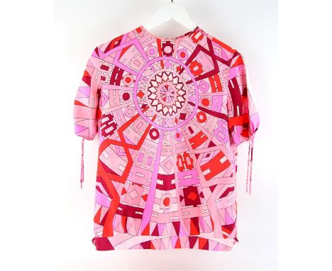 Emilio Pucci a silk blouse in shades of pink and red  with wheel and geometric design .    CONDITION REPORTS ON TEXTILE LOTS 