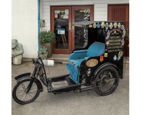 Of Channel Island and Dame of Sark historical interest, a vintage invalid carriage, tri-cycle design, mid-20th century, with 