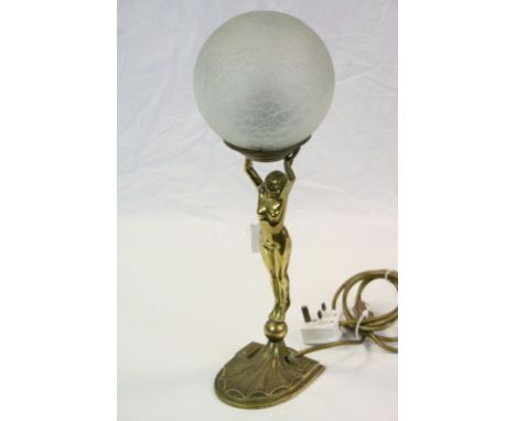 Art Deco Brass table Lamp modelled as a Nude Female, holding aloft a Crackle Glass ball shade, stands approx 46cm in total
