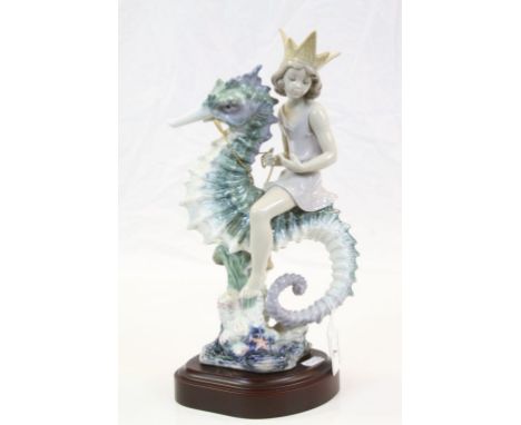 Large Lladro ceramic model "Mermaid on Seahorse", with attached wood effect base, stands approx 32cm including the base